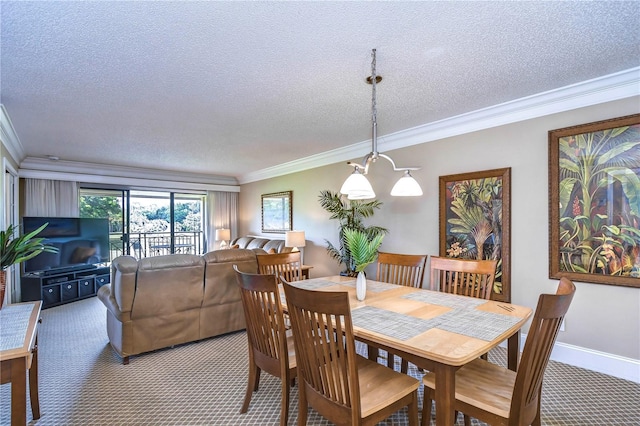 dining space featuring crown molding, carpet, and a textured ceiling