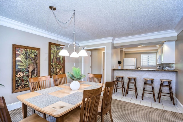 tiled dining room featuring ornamental molding, a chandelier, and a textured ceiling