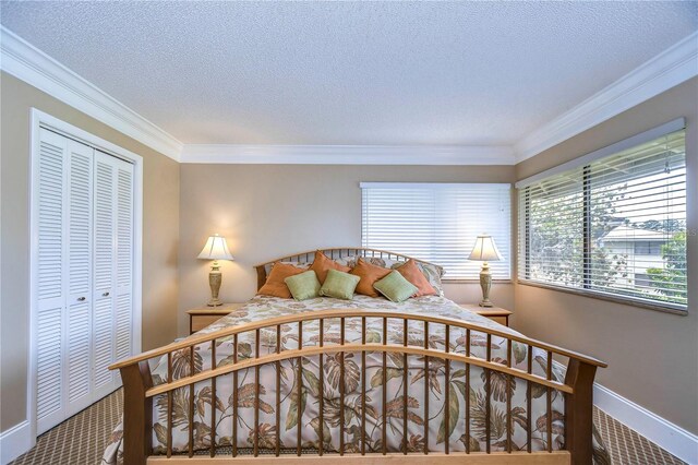 bedroom with a closet, crown molding, and a textured ceiling