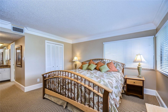 bedroom featuring ornamental molding, a closet, and carpet flooring