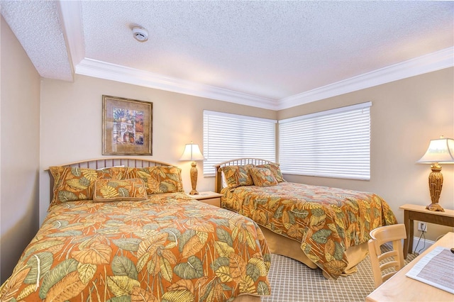 bedroom featuring a textured ceiling, ornamental molding, and multiple windows