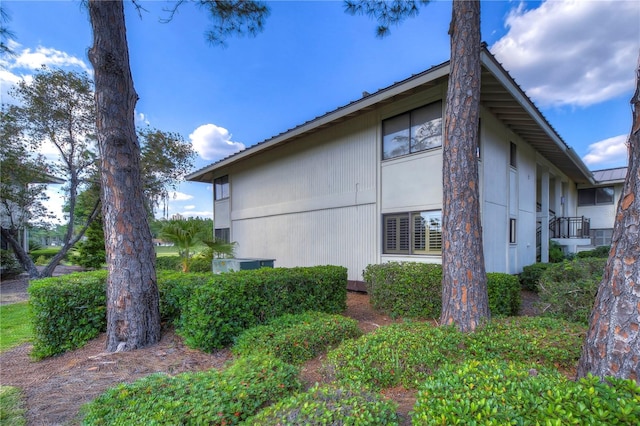 view of side of property with a balcony