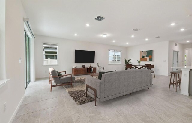 living room with light tile patterned floors