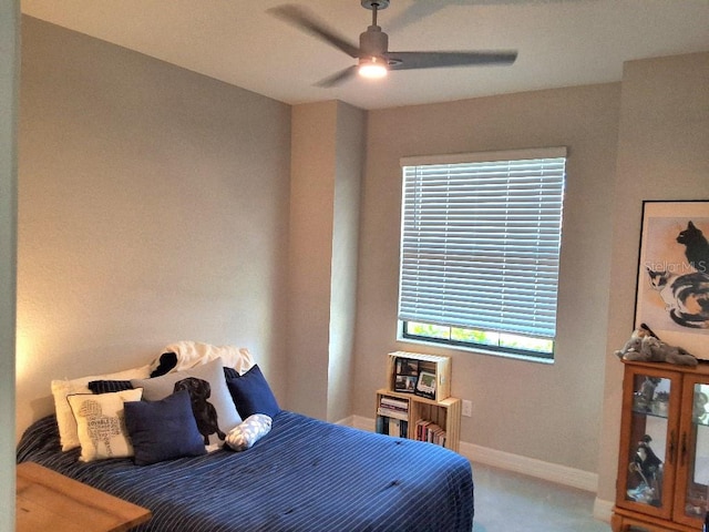 bedroom with ceiling fan and carpet floors