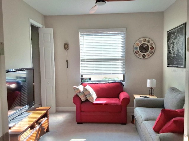 living room featuring ceiling fan and carpet flooring