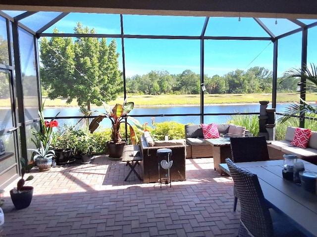 sunroom with a water view