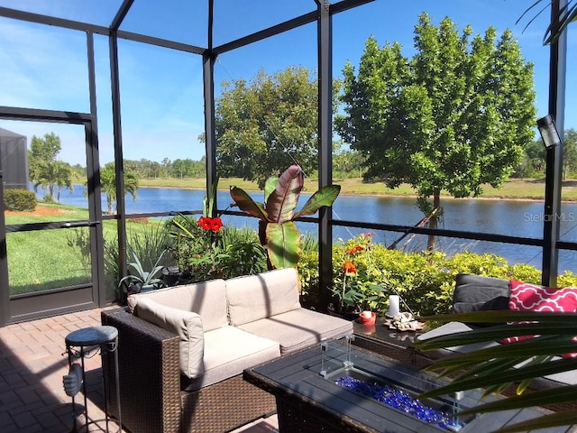 sunroom / solarium with a water view