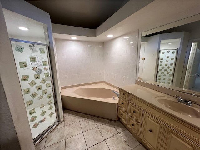 bathroom featuring vanity, a tub, and tile floors