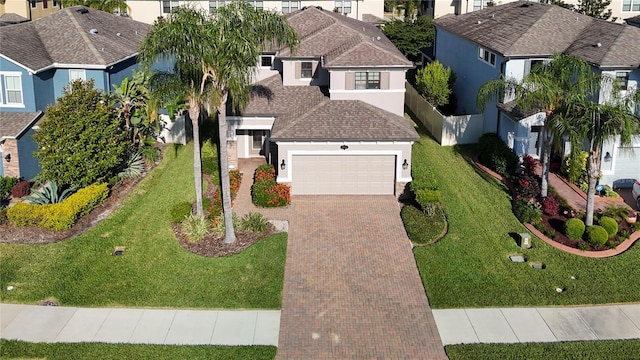 view of front facade with a garage and a front yard