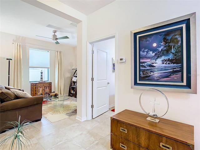 hallway featuring light tile flooring