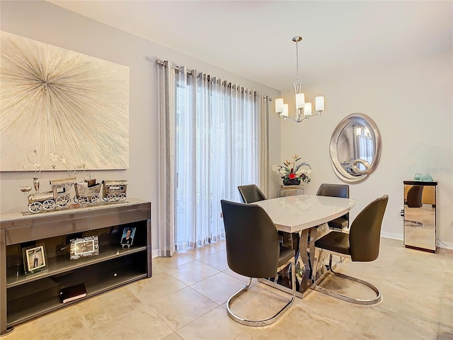 dining room with light tile floors and an inviting chandelier