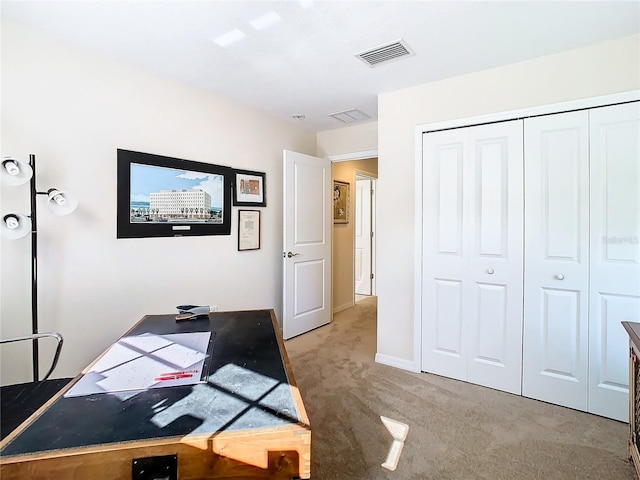 office space with light colored carpet