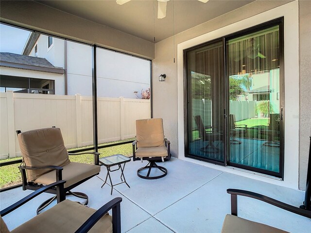 sunroom / solarium with ceiling fan