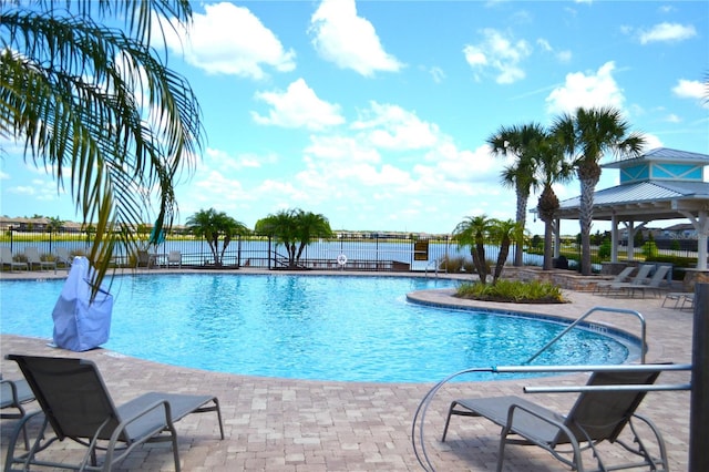 view of swimming pool featuring a patio area and a gazebo