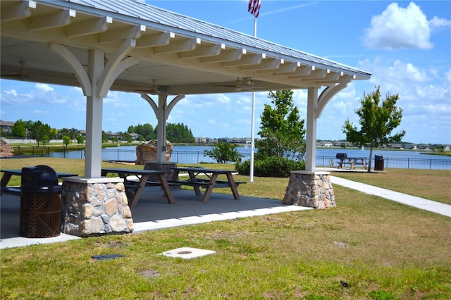 view of nearby features with a water view, a gazebo, a yard, and a patio area