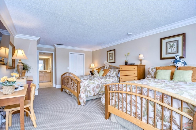 carpeted bedroom featuring a closet, a textured ceiling, ensuite bathroom, and ornamental molding