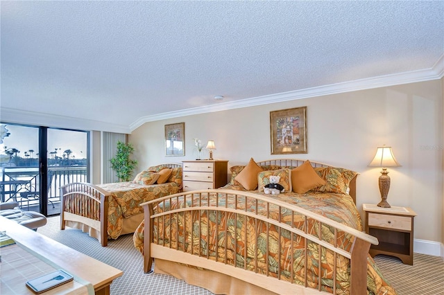 bedroom featuring a textured ceiling, carpet floors, crown molding, and access to outside