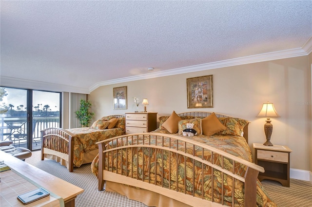 carpeted bedroom featuring crown molding, access to outside, and a textured ceiling