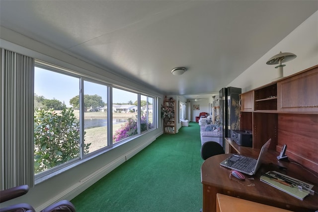 home office featuring dark colored carpet and baseboards