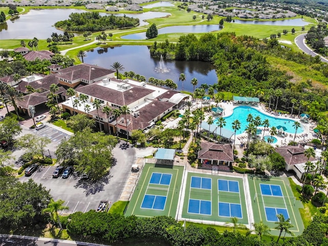 drone / aerial view featuring a water view and a residential view