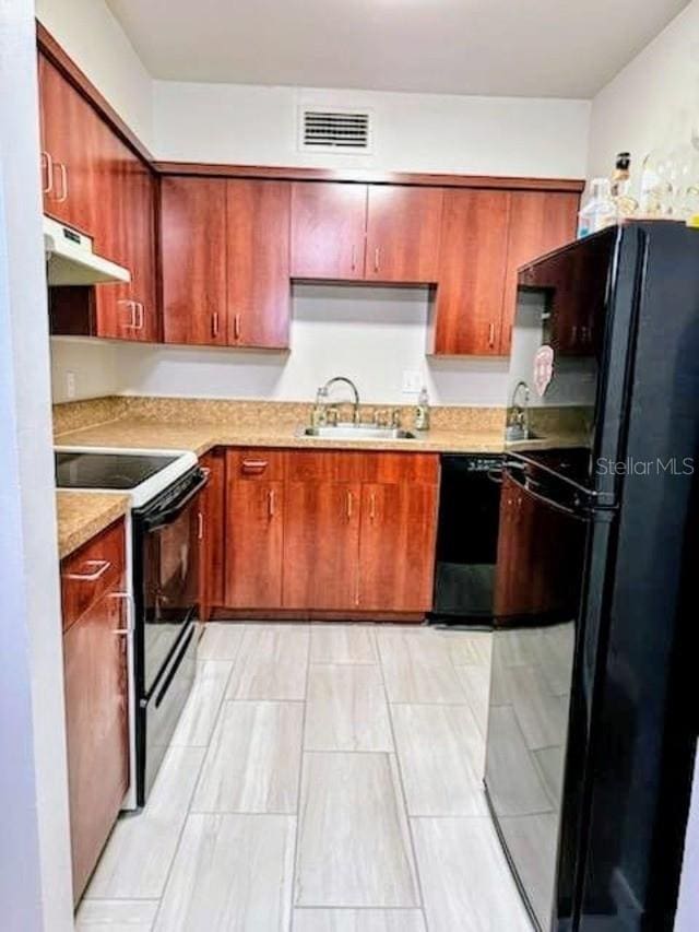 kitchen with sink and black appliances