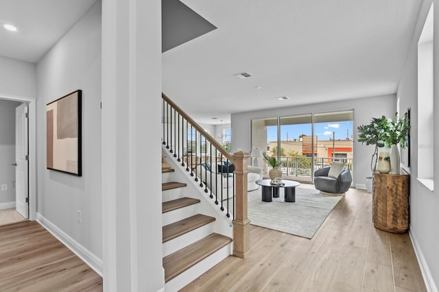 stairway featuring hardwood / wood-style floors