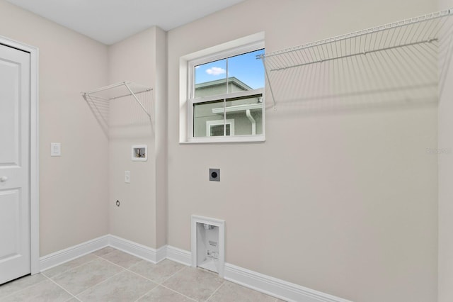 washroom with gas dryer hookup, washer hookup, tile patterned flooring, and electric dryer hookup