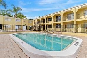 view of pool with fence