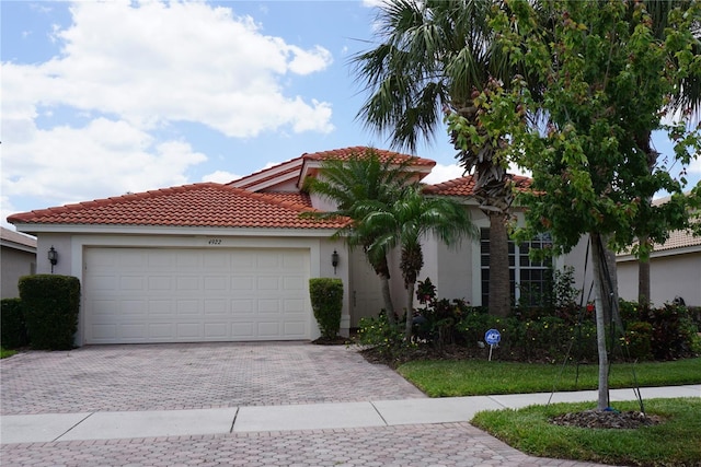 mediterranean / spanish-style house featuring a garage