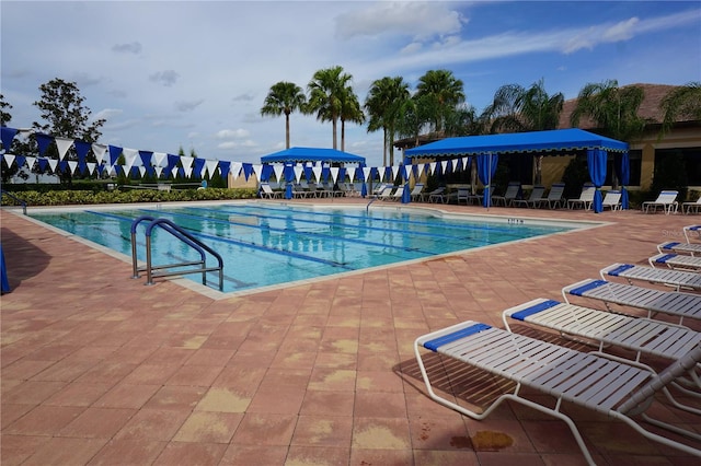 view of swimming pool with a patio