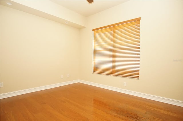 empty room with hardwood / wood-style floors