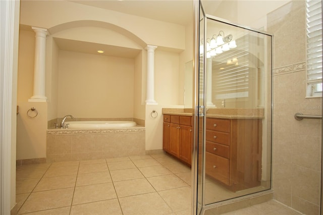 bathroom with tile patterned floors, vanity, ornate columns, and independent shower and bath