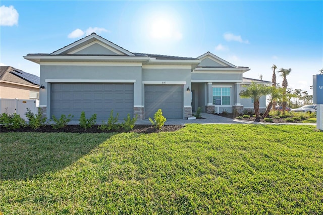 view of front of house with solar panels, a garage, and a front lawn