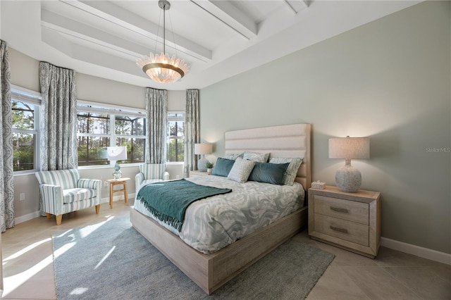 tiled bedroom with beamed ceiling, a notable chandelier, and a tray ceiling