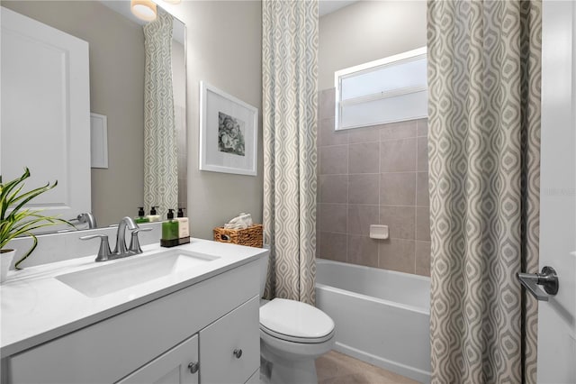 full bathroom featuring toilet, large vanity, and shower / bathtub combination with curtain