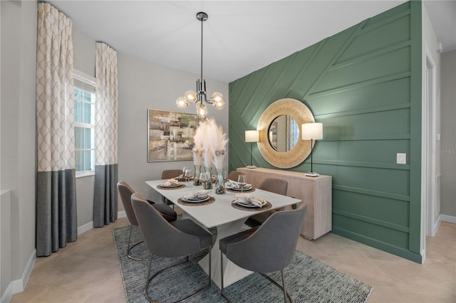 tiled dining space with an inviting chandelier