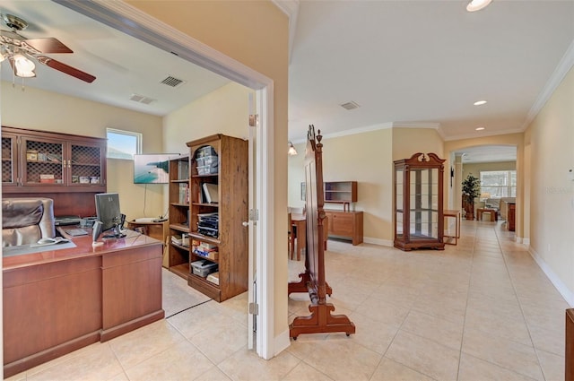 office featuring crown molding, light tile patterned floors, a healthy amount of sunlight, and ceiling fan