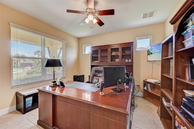 tiled home office with ceiling fan