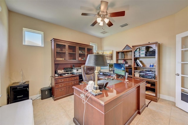 home office featuring ceiling fan and light tile patterned floors