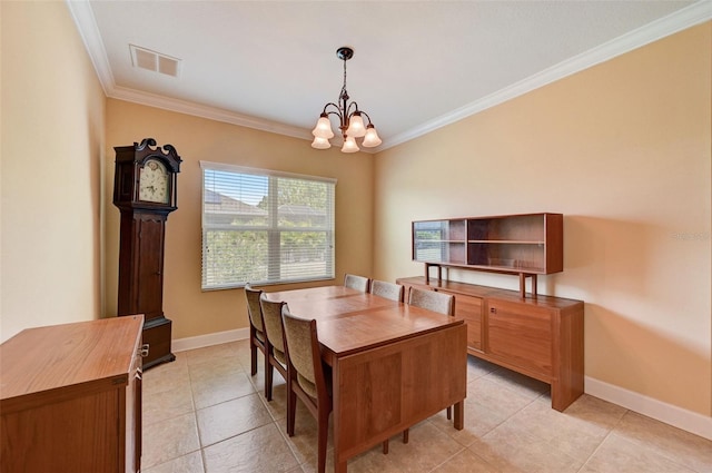 tiled dining space with an inviting chandelier and crown molding