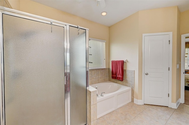 bathroom with tile patterned floors and independent shower and bath