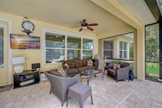 sunroom / solarium with ceiling fan