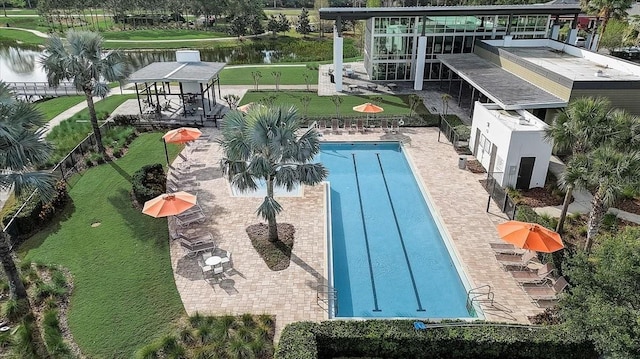 view of pool featuring a gazebo and a water view