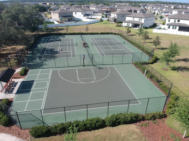 view of sport court featuring tennis court