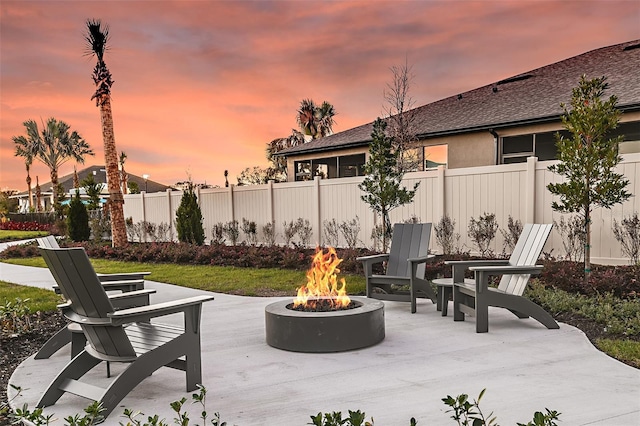 patio terrace at dusk with an outdoor fire pit