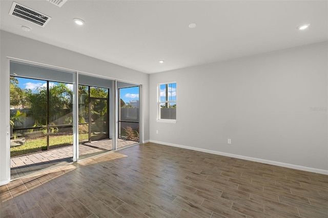 empty room with dark wood-type flooring