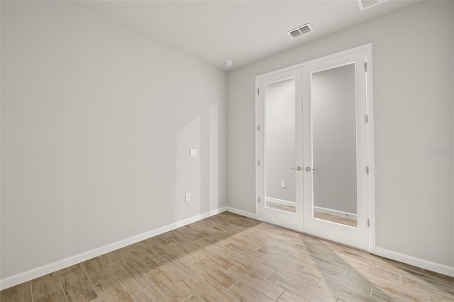 spare room featuring light hardwood / wood-style flooring