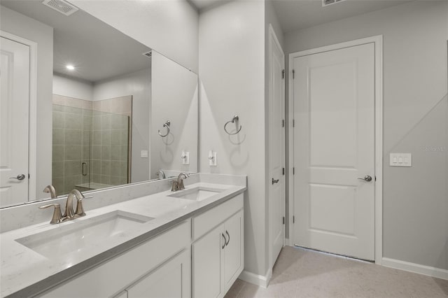 bathroom featuring vanity and an enclosed shower