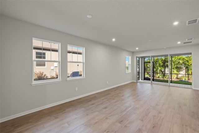 spare room featuring light hardwood / wood-style flooring