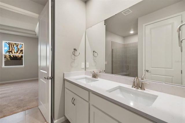 bathroom with tile patterned floors, vanity, and a shower with shower door